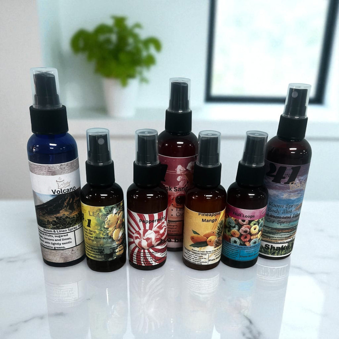Collection of assorted long lasting room sprays with various scents displayed on a marble surface