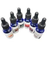 Selected Scent blue bottles with black droppers containing pure fragrance oils for diffusers in various scents
