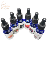 Selected Scent blue bottles with black droppers containing pure fragrance oils for diffusers in various scents