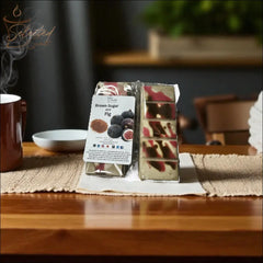 Selected Scent brown sugar fig scented home fragrance wax bars on wooden table with steaming cup nearby