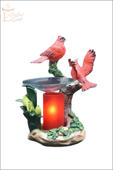 Selected Scent cardinals oil warmer with two red cardinal birds and a glowing candle holder
