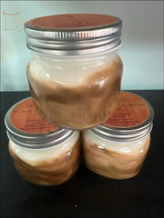 Selected Scent Freshly Made Closet Scent in three small jars with wooden lids on black surface