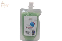 Selected Scent cotton candy squeezable wax melt in a green resealable pouch with blue cotton candy image