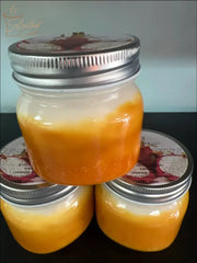 Selected Scent jars with strong fruity scent featuring layered orange and cream colors with silver lids