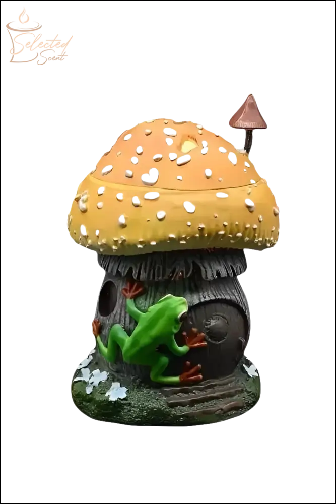 Selected Scent frog and mushroom wax warmer with green frog climbing brown mushroom house with orange cap