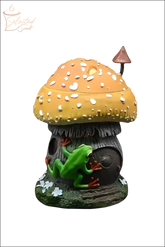Selected Scent frog and mushroom wax warmer with green frog climbing brown mushroom house with orange cap