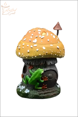Selected Scent frog and mushroom wax warmer with green frog climbing brown mushroom house with orange cap