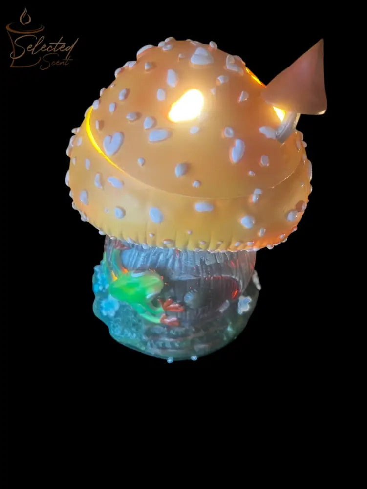 Selected Scent frog and mushroom wax warmer with glowing yellow mushroom cap and small green frog detail