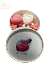 Selected Scent white round tin with pink and white heart shaped and mini hearts love spell wax melts