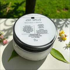 Selected Scent Love Spells massage candle with mango butter and vitamin E in a clear jar with a silver lid