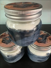 Selected Scent candle jars with silver lids featuring All Around Great Musky Scent in blue and white design