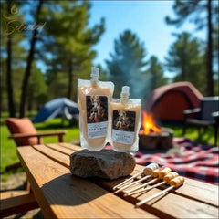 Selected Scent Fall Seasonal Favorites marshmallow roasting packs by campfire with tents in background