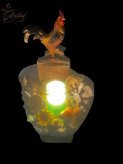 Selected Scent Electric Decorative Warmer with rooster design and detailed floral and wheel accents glowing warmly