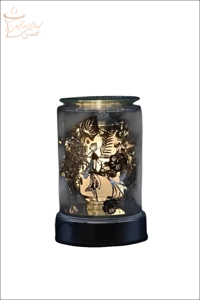 Selected Scent electric decorative warmer with intricate leaf patterns and warm glowing light