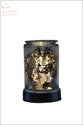 Selected Scent electric decorative warmer with intricate leaf patterns and warm glowing light