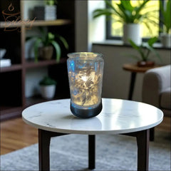 Selected Scent electric decorative warmer with frosted glass and floral design on white marble table