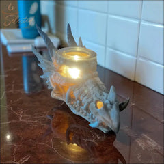 Selected Scent Electric Decorative Warmer shaped like a dragon head with glowing light on marble countertop