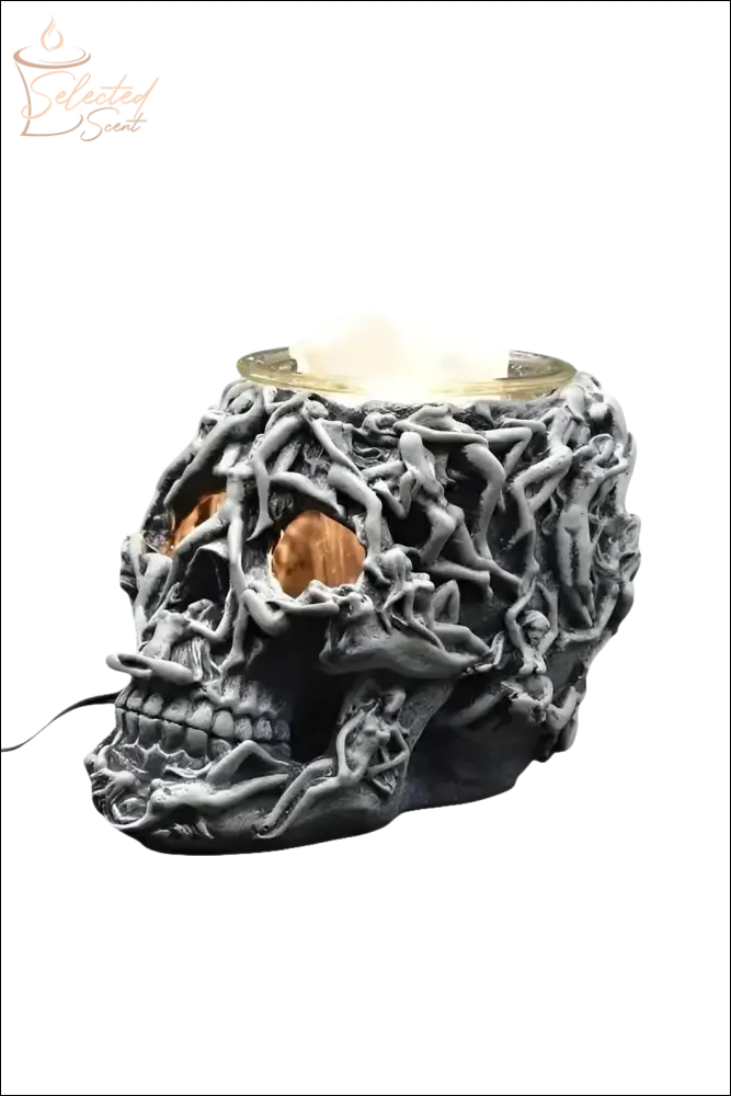 Selected Scent electric decorative warmer shaped like a detailed black skull with twisted vine design