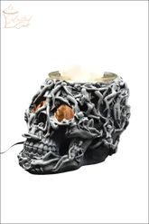 Selected Scent electric decorative warmer shaped like a detailed black skull with twisted vine design