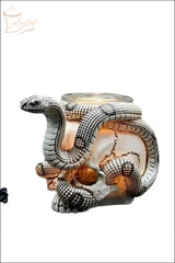 Selected Scent Electric Decorative Warmer shaped like a skull with a detailed snake wrapped around it