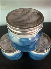 Selected Scent blue and white jar candles with metal lids featuring a soft and clean scent
