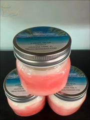 Selected Scent scented candles in pink and white with Chilling On The Beach label and silver lids