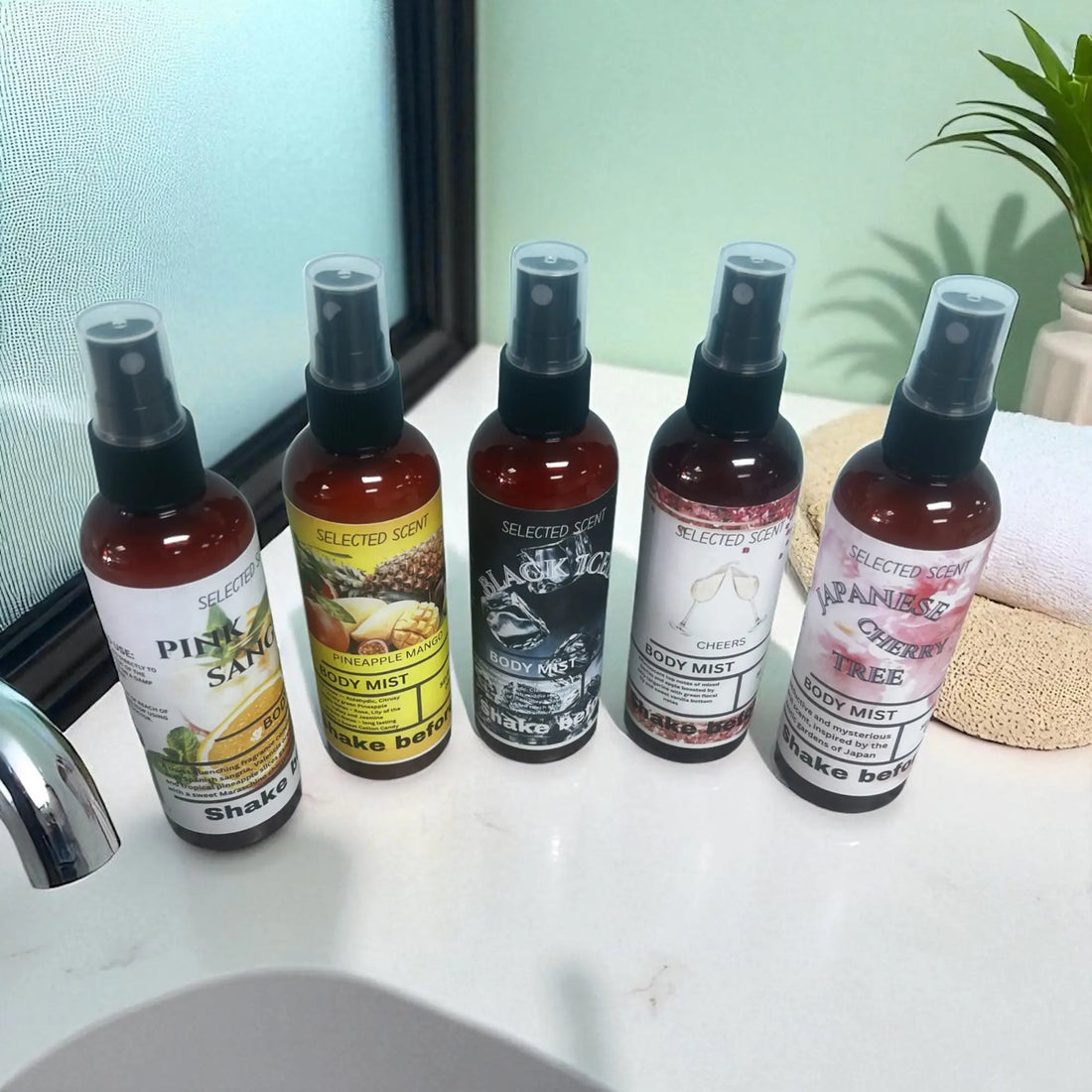 Best body mists for daily use Animal Safe collection with five scented spray bottles on bathroom counter