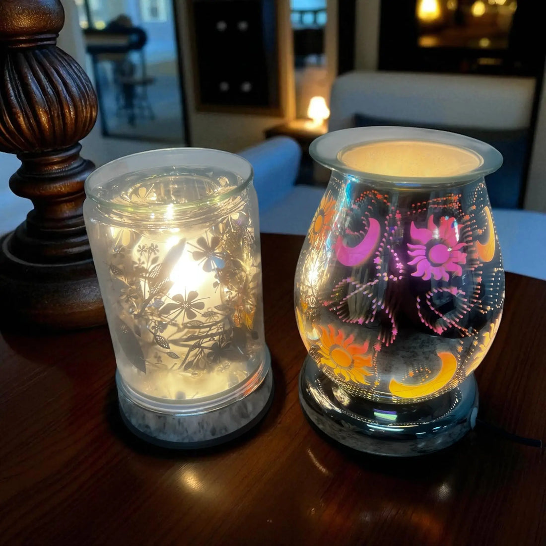 Electric Multi Settings scented wax warmers with decorative glass designs glowing on a wooden table