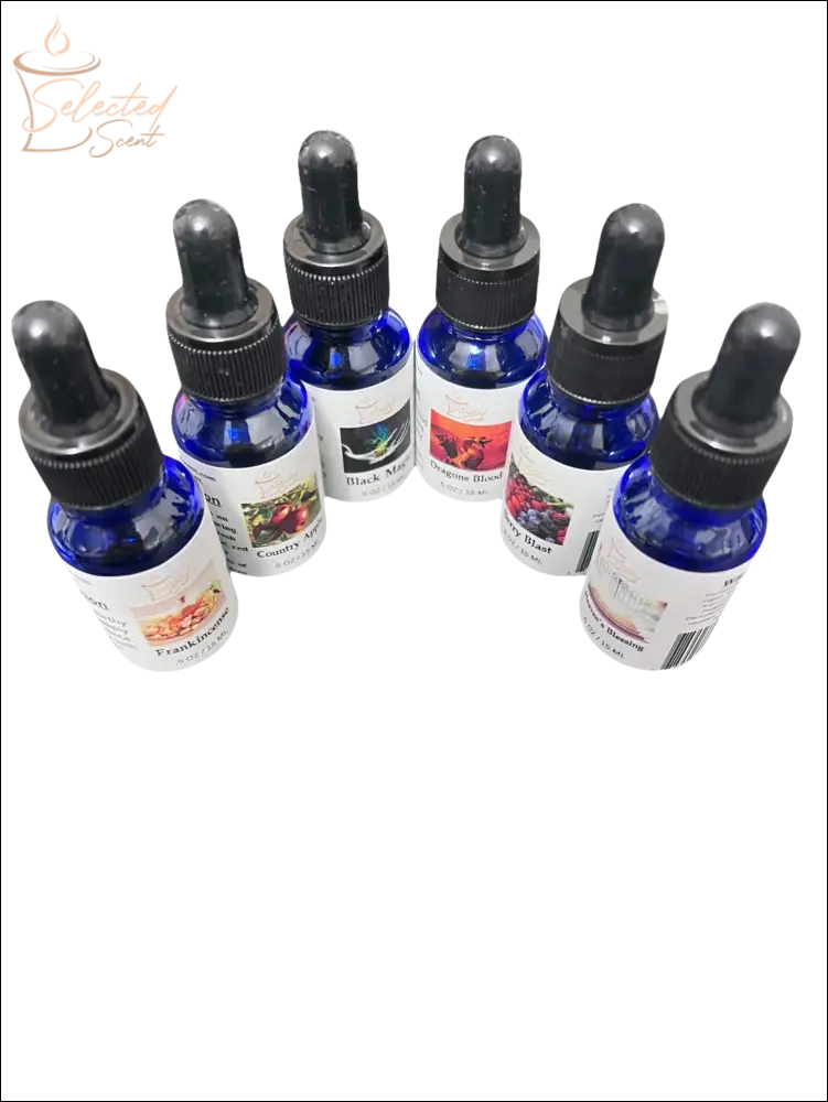 Selected Scent blue bottles with black droppers containing pure fragrance oils for diffusers in various scents