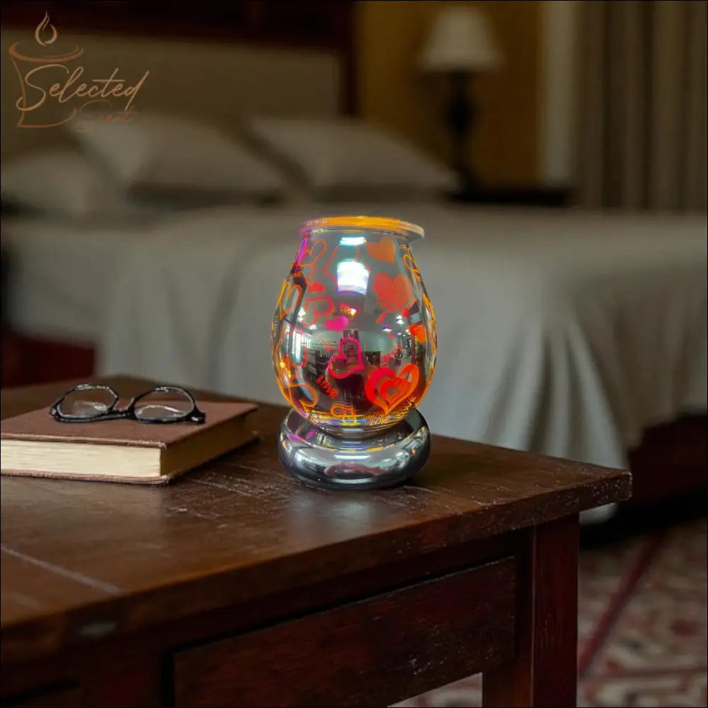 Selected Scent Electric Decorative Warmer with colorful heart designs on wooden bedside table