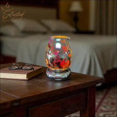 Selected Scent Electric Decorative Warmer with colorful heart designs on wooden bedside table