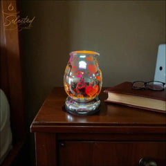 Selected Scent Electric Decorative Warmer with red heart designs glowing on wooden nightstand