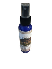 Selected Scent Volcano spray bottle labeled An Eruption of Scent fragrance mist in blue container