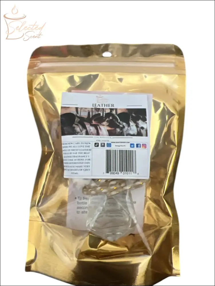 Selected Scent long lasting car air freshener in leather scent with clear bottle in gold packaging
