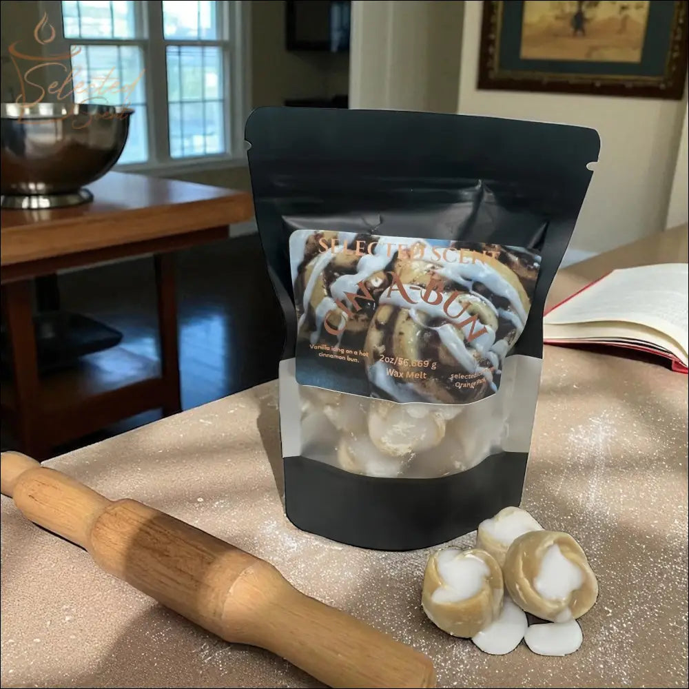 Selected Scent long lasting bakery scented wax melt package with cinnamon rolls and rolling pin on counter