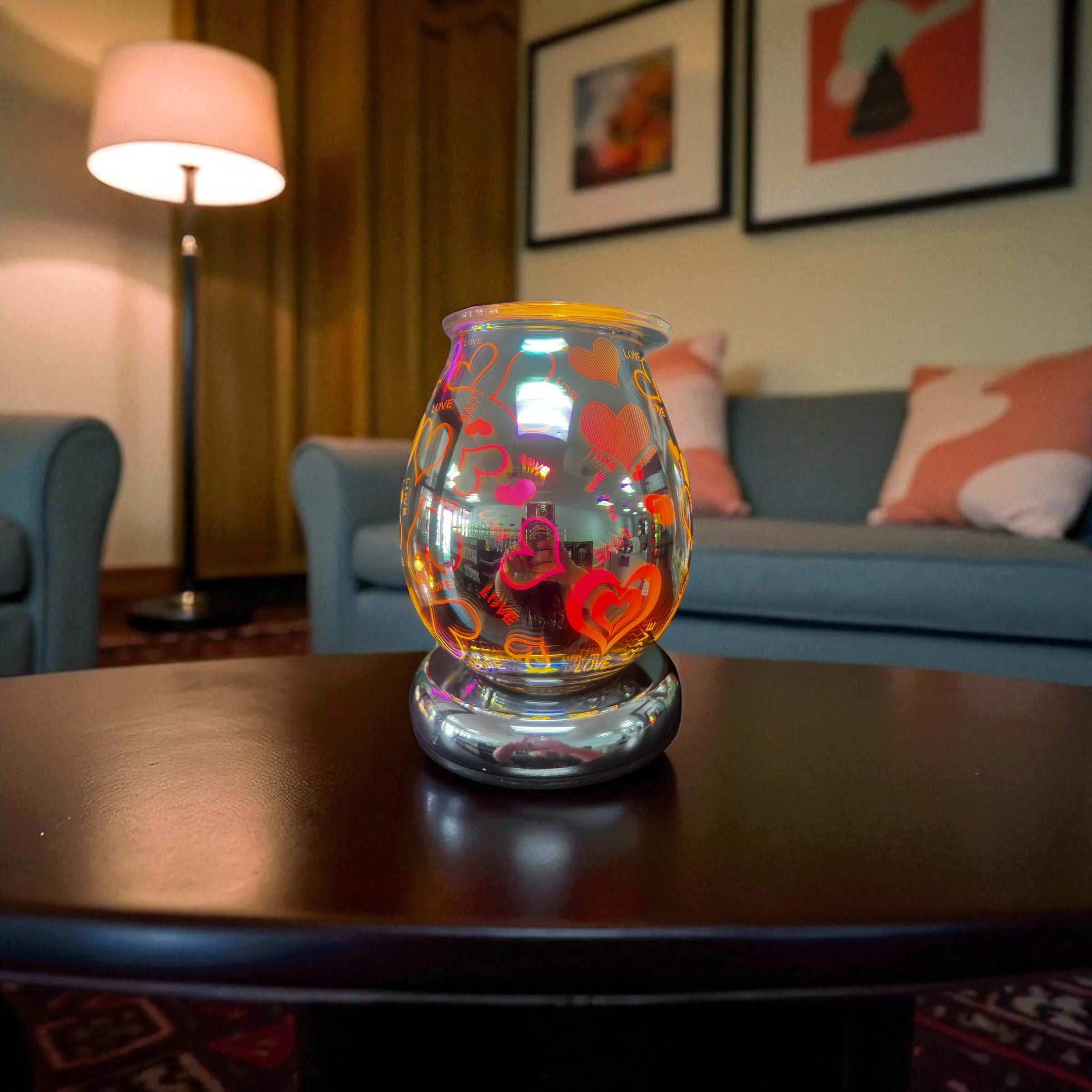 Selected Scent Electric Decorative Warmer with colorful heart designs on a living room table