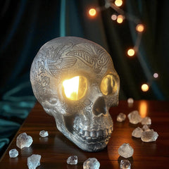 Selected Scent electric decorative warmer shaped like an engraved skull with light glowing from the eyes