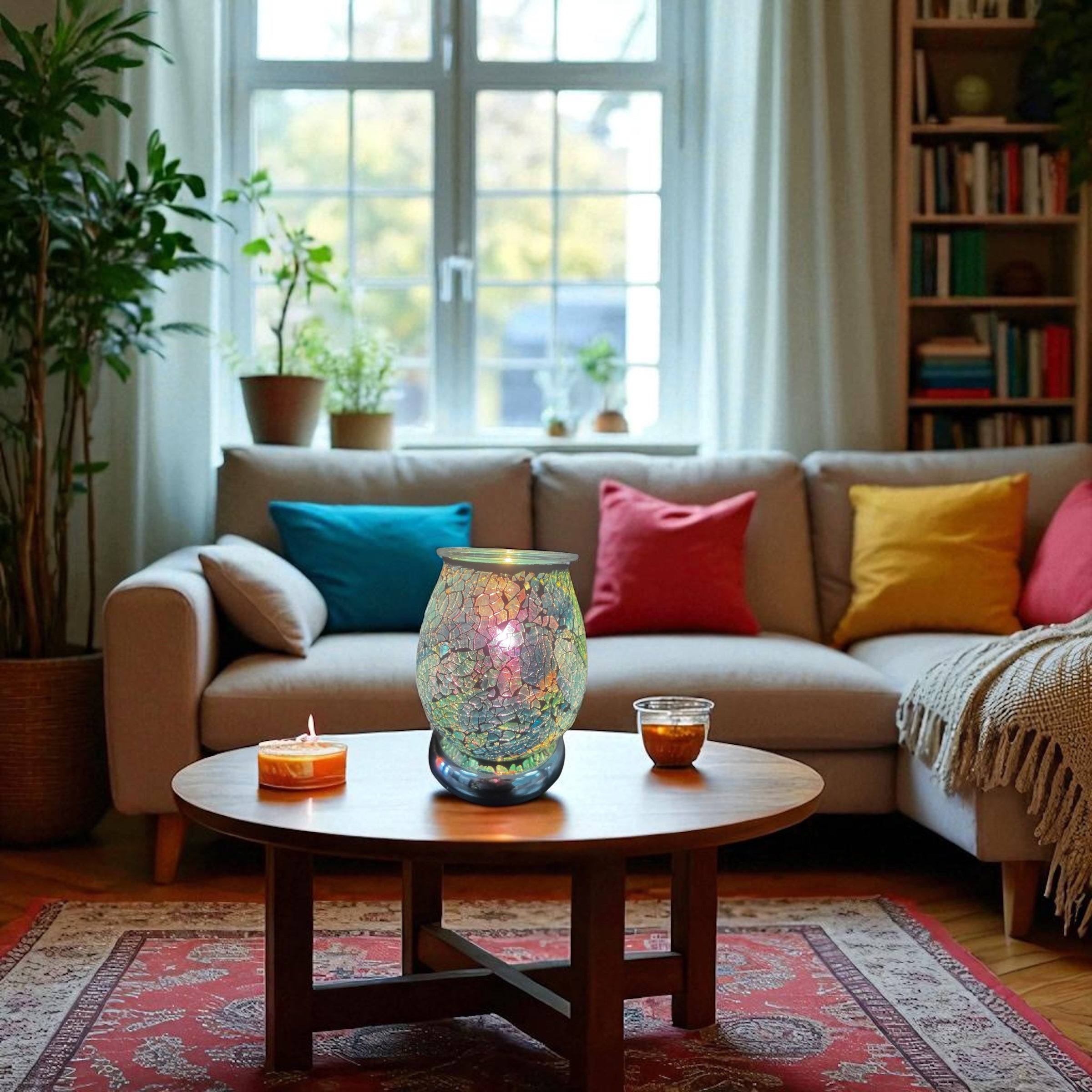 Electric Decorative Warmer with mosaic design glowing on wooden coffee table in cozy living room