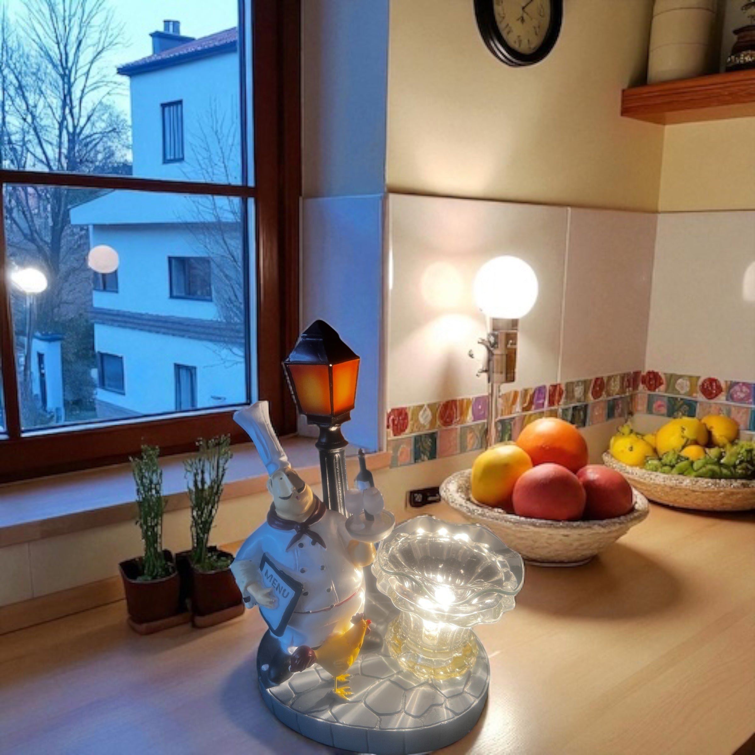 Selected Scent Electric Decorative Warmer shaped like a chef holding a lamp on a kitchen counter