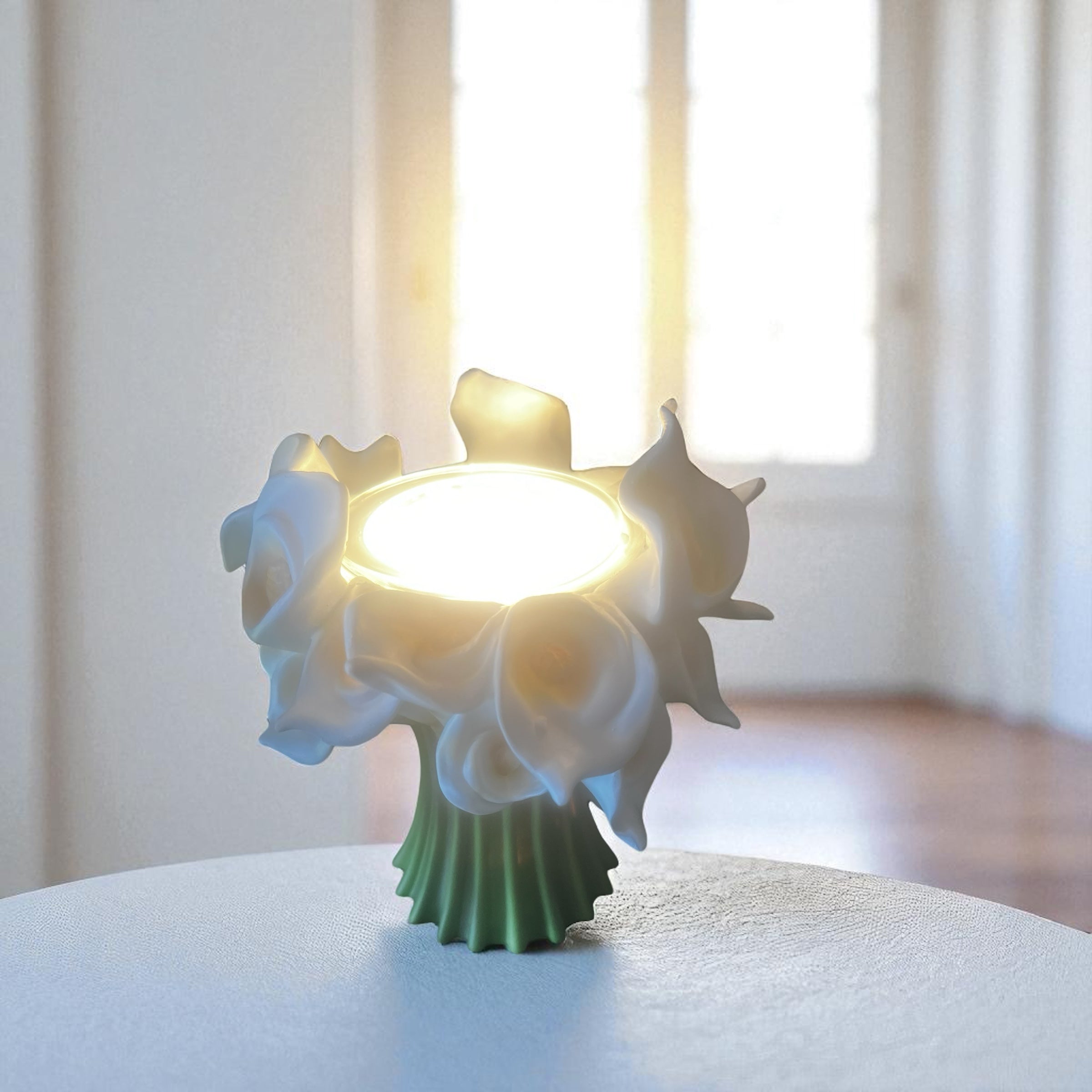 Selected Scent Electric Decorative Warmer with white flower design glowing on a table