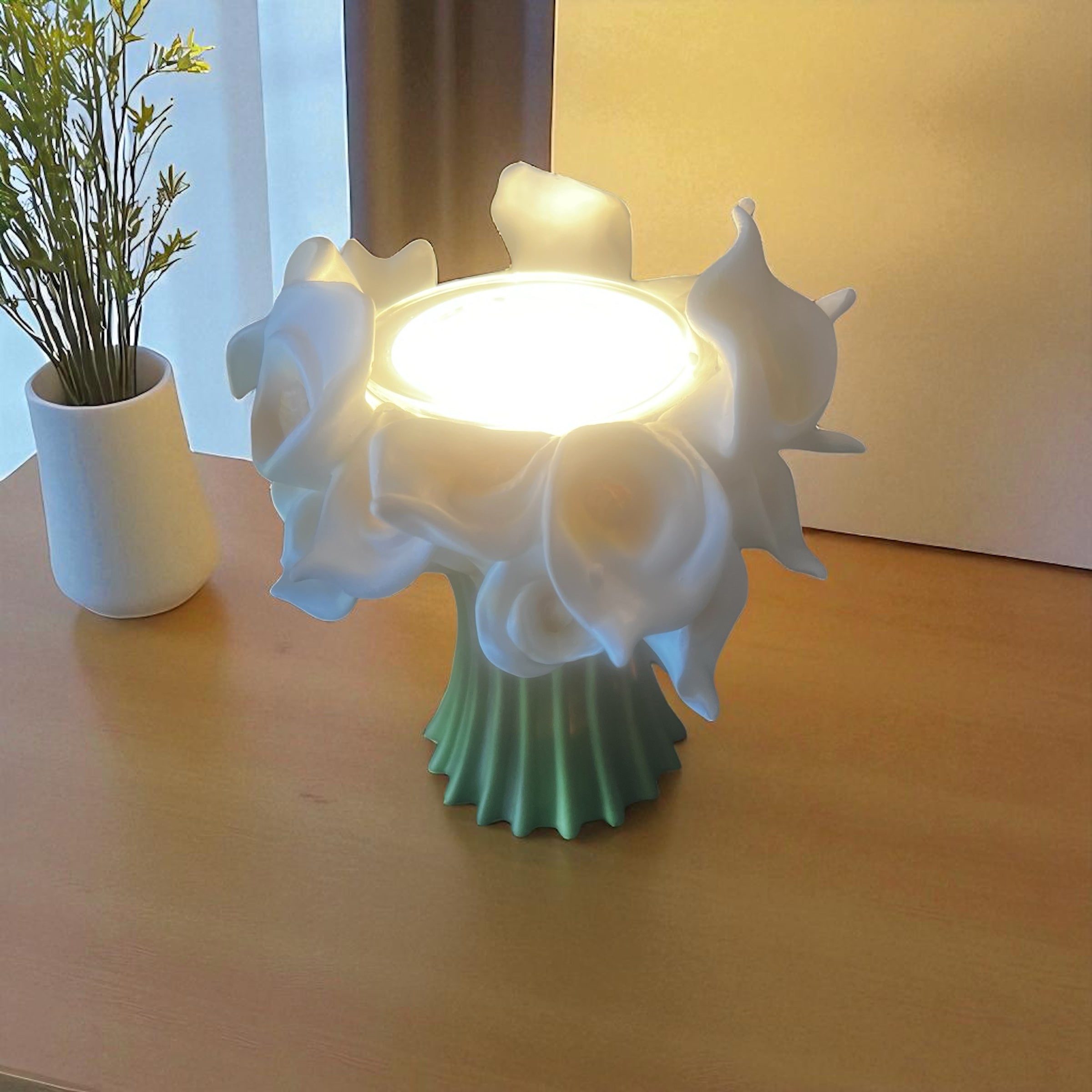 Selected Scent electric decorative warmer with white floral design and green base on wooden table
