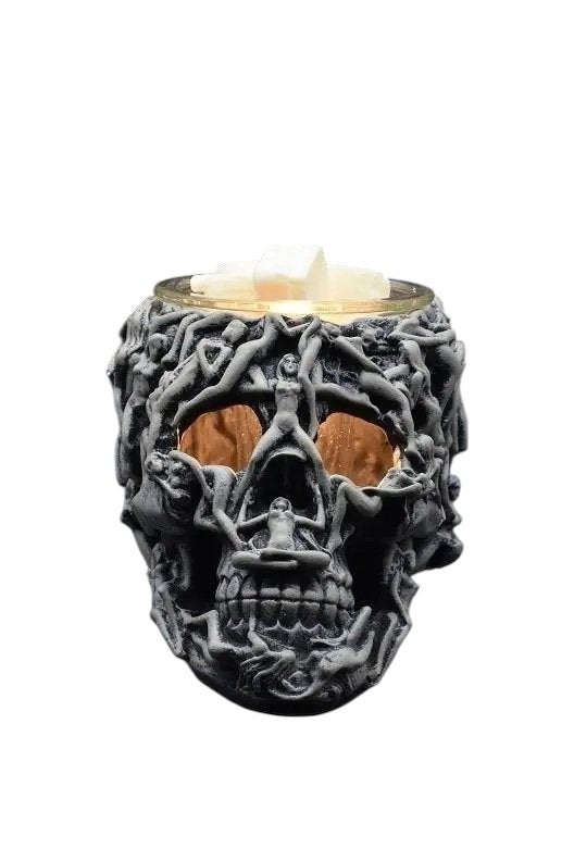 Selected Scent Electric Decorative Warmer shaped like a skull with intricate human figure design