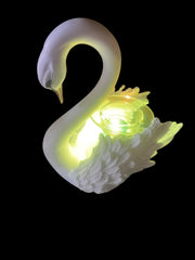 Selected Scent electric decorative warmer shaped like a glowing white swan with intricate feather details