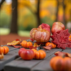 Selected Scent pumpkin and leaves wax melts arranged with miniature pumpkins and autumn leaves on a wooden table