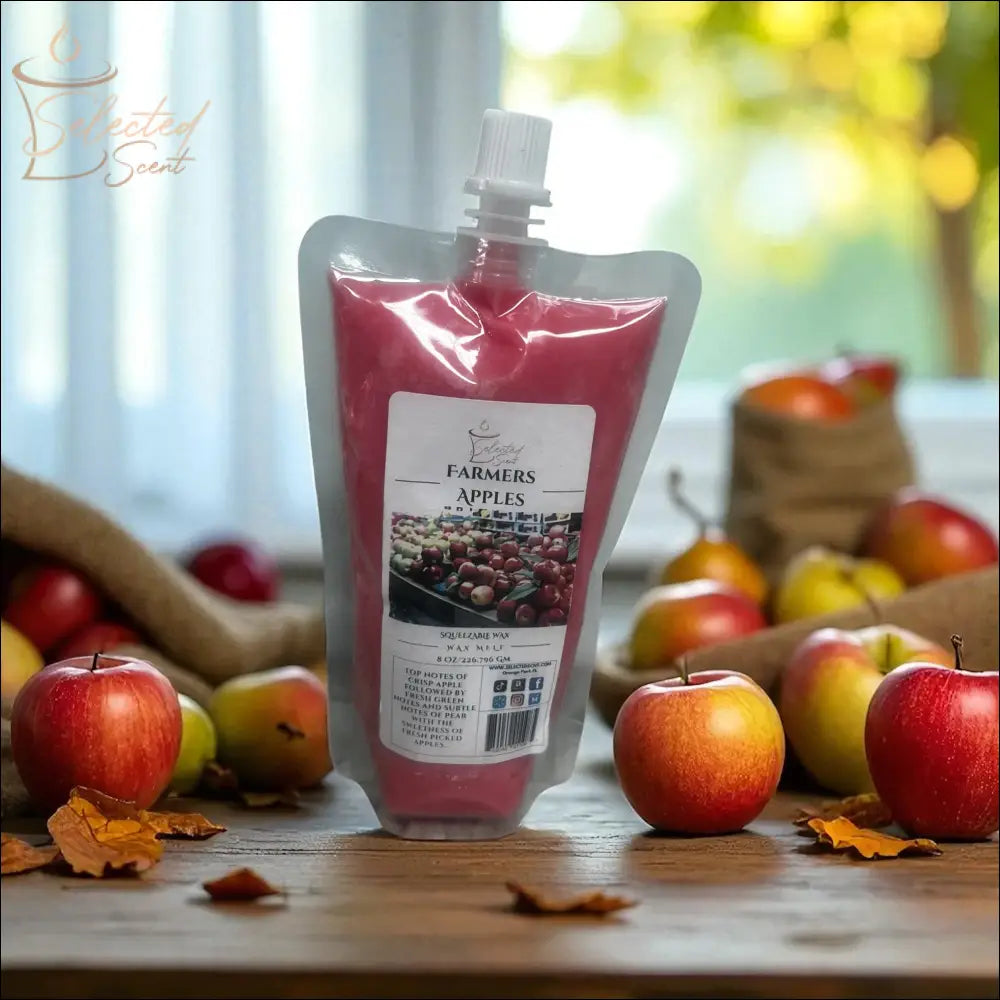 Selected Scent Farmers Apples wax pouch surrounded by fresh apples with long lasting far throw scent