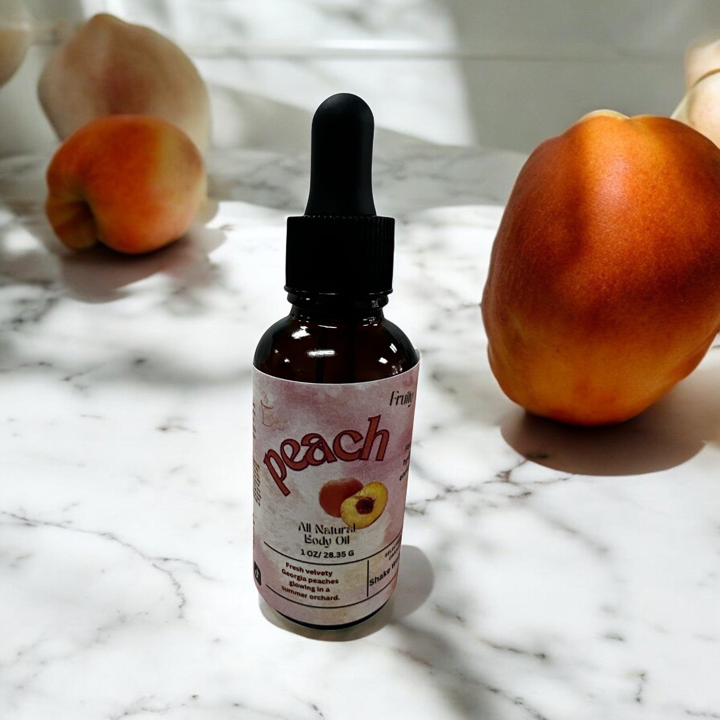 Selected Scent peach oil bottle on marble surface surrounded by peaches hydrating and protecting skin