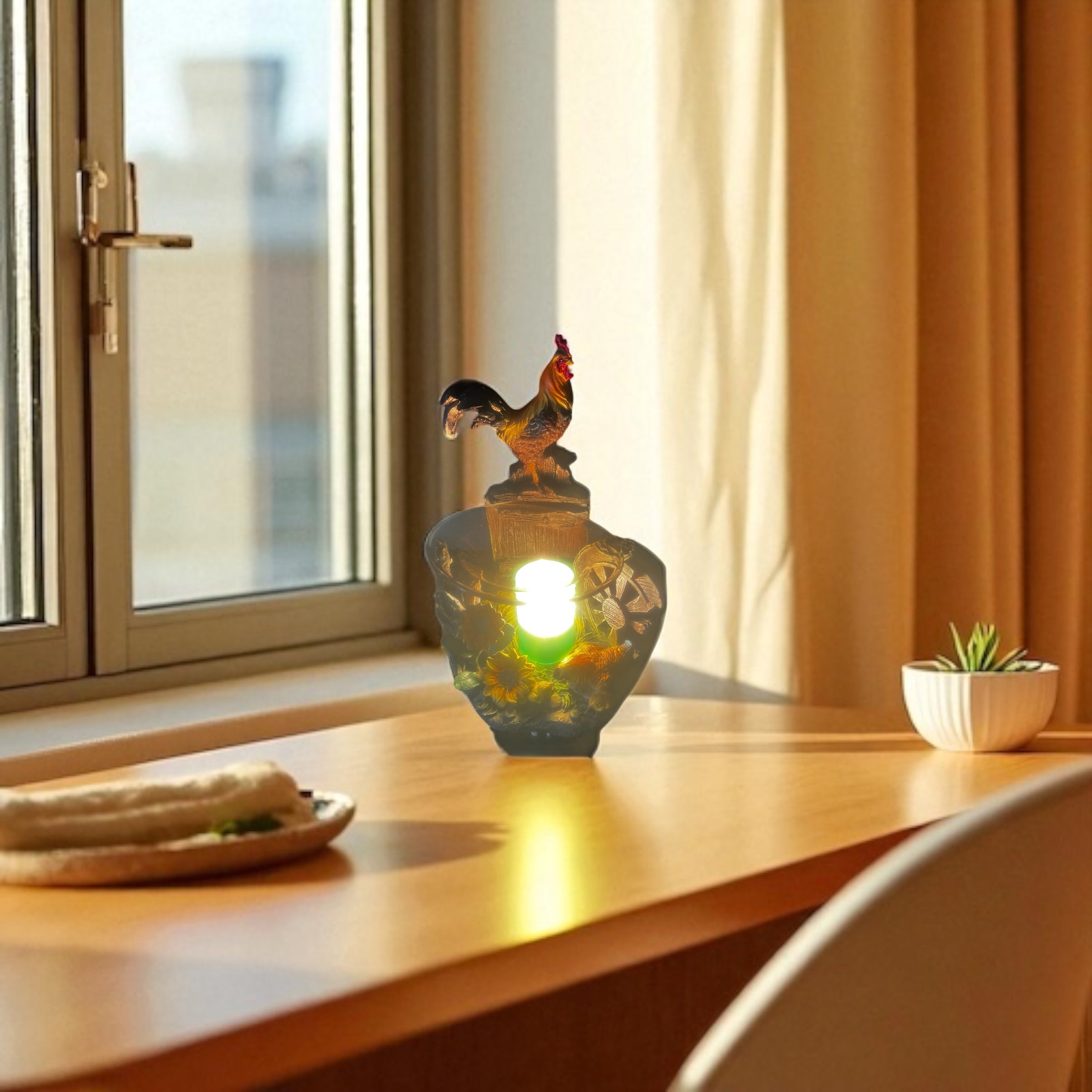 Selected Scent electric decorative warmer with rooster design glowing on wooden table by window