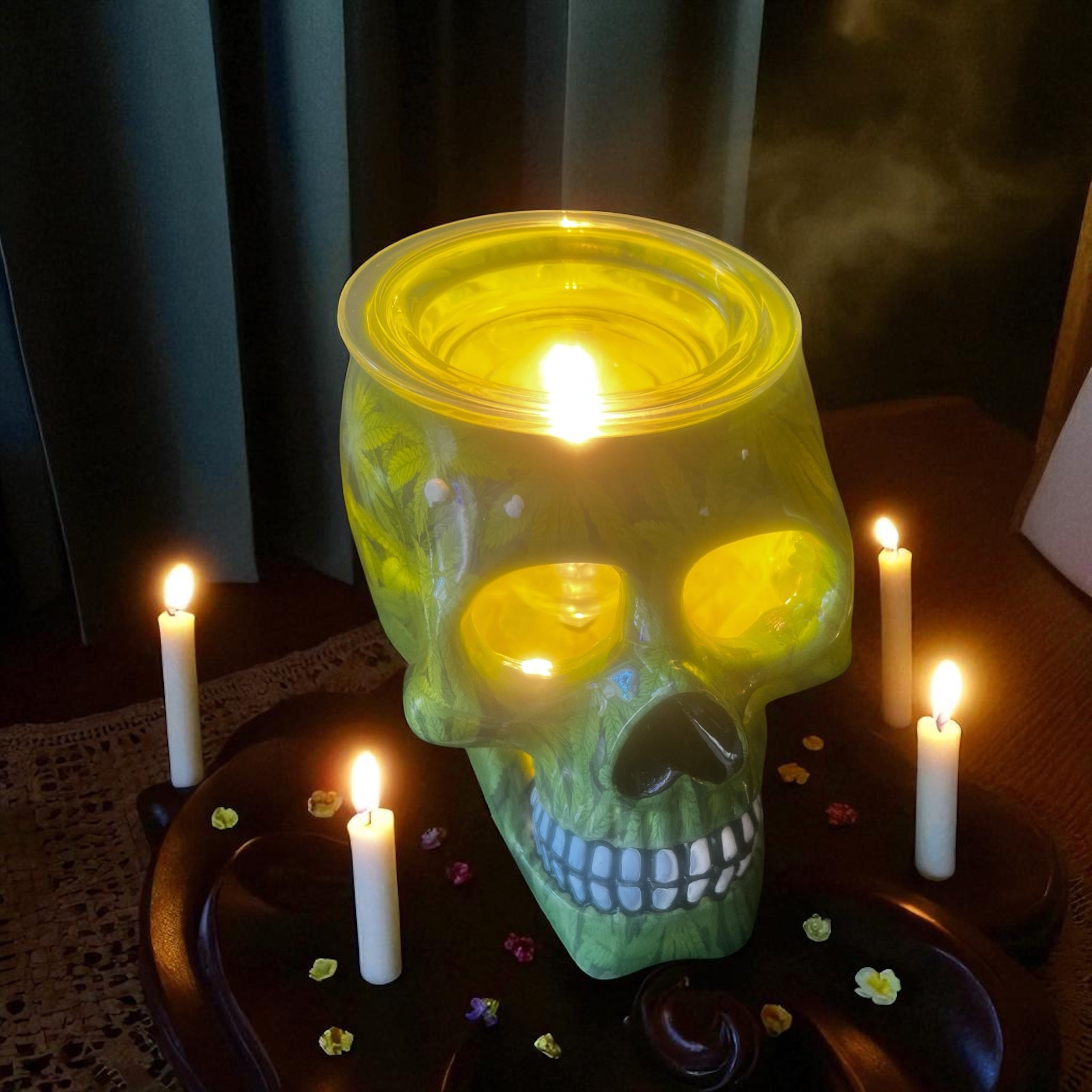 Selected Scent green skull Electric Decorative Warmer with candles on dark wooden table