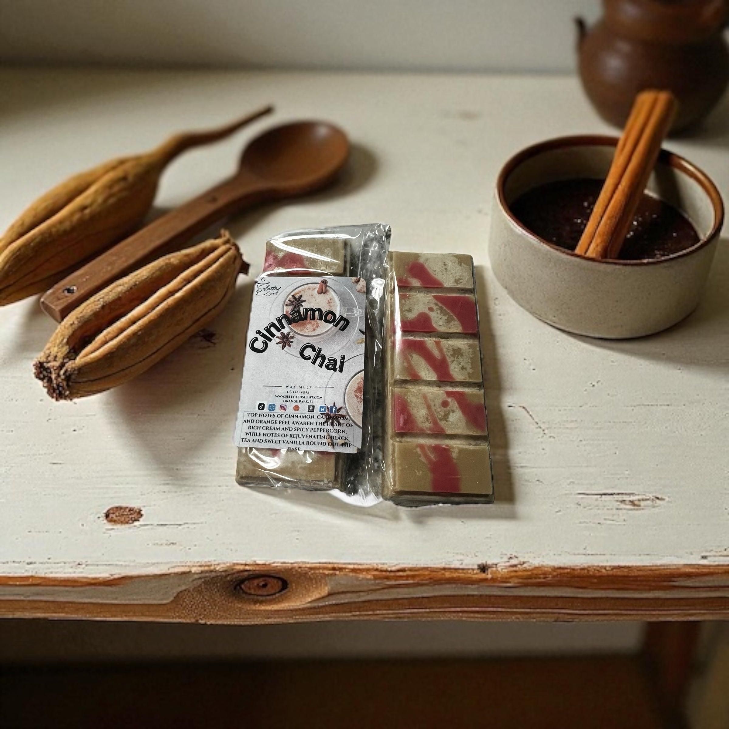 Selected Scent cinnamon chai scented home decor wax melts with cinnamon stick and wooden spoon on rustic table