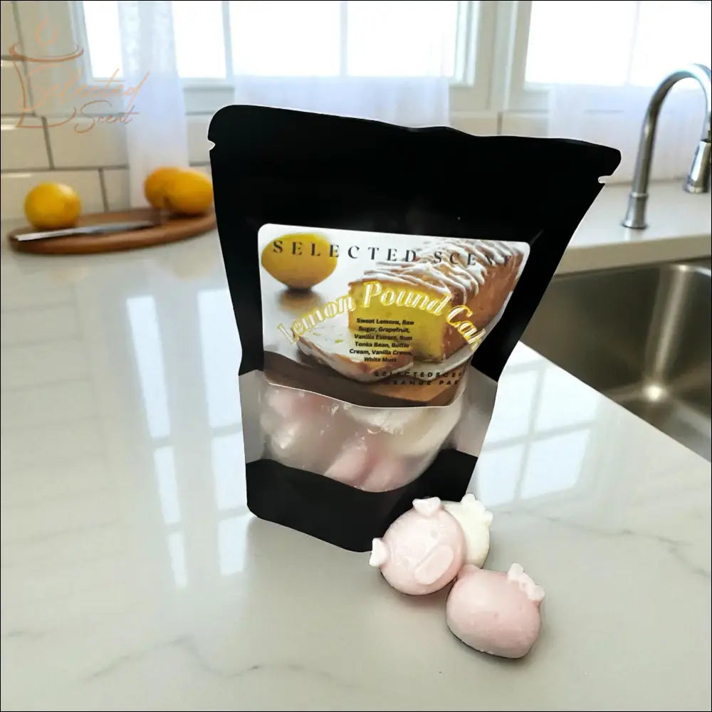Selected Scent Lemon Pound Cake candy bag with cute design pink and white candies on marble countertop